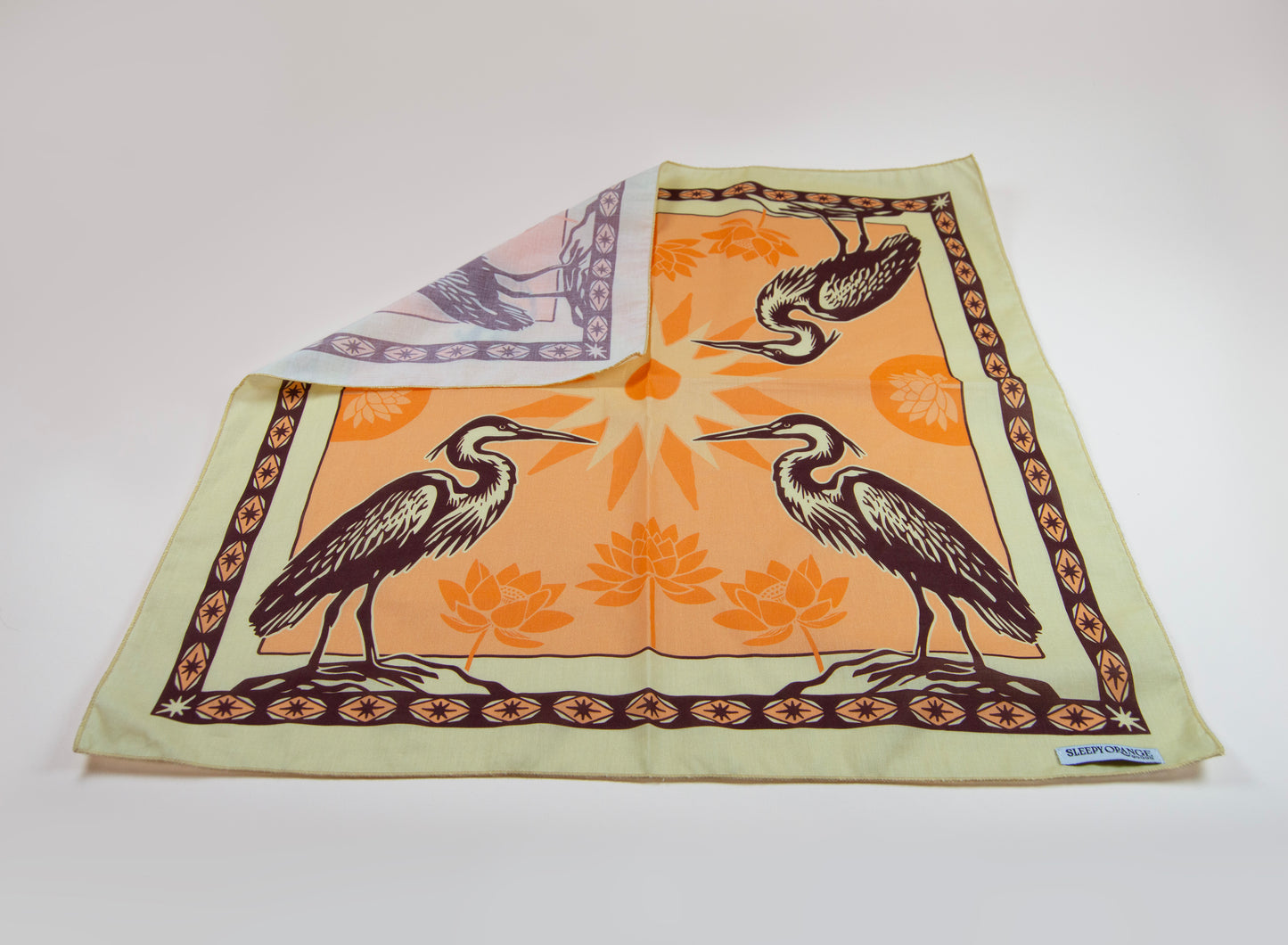 a scarf with two birds on it
