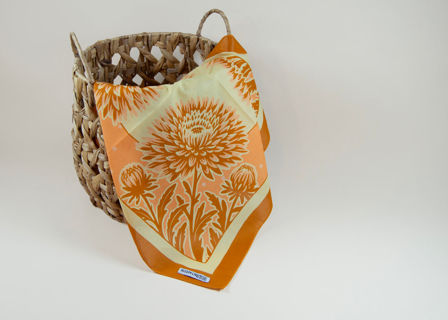 a basket with a flower design on it